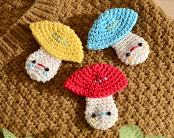 Crocheted mushroom brooch