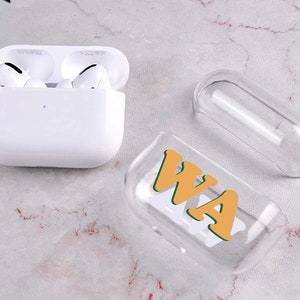 May include: A clear plastic case for AirPods with a yellow and green "WA" graphic.