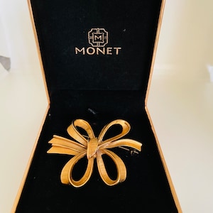 Vintage Monet gold tone bow brooch pin