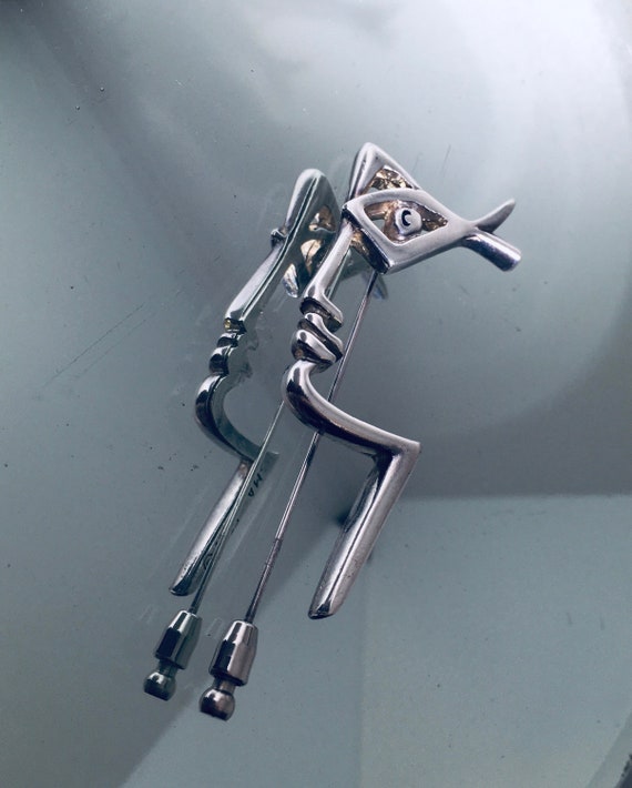 Jean Cocteau lapel tie pin