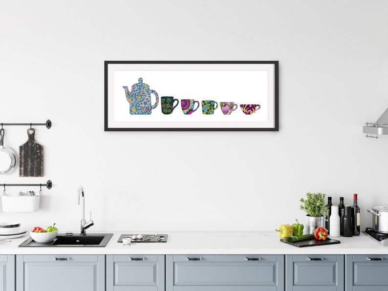 May include: A framed print of a teapot and five cups, all with colorful floral patterns. The teapot is blue and white, the cups are various colors, including green, purple, and pink.