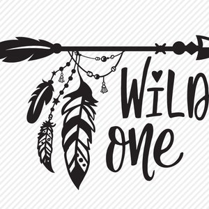 May include: Black and white graphic design with an arrow, feathers, and beads. The text "WILD one" is written in a stylized font.