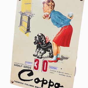 May include: A vintage calendar featuring a girl with a dog, a ball of wool, and a knitting machine. The calendar is for 30th December and is advertising Coppo, an Italian knitting machine manufacturer. The text on the calendar reads "Concessionario Esclusivo Casali Sergio, Piazza Aurelio Saffi, 1 Forli, Telefono 25.375, Coppo Fabbrica Italiana Macchine per Maglieria."