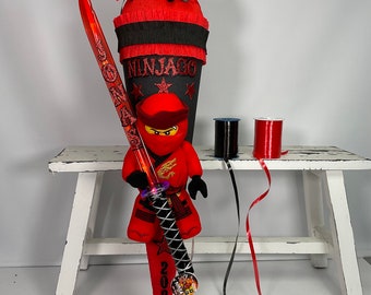 School bag sugar bag with Ninjago Kai plush figure lightsaber name