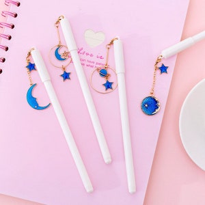 Penne stellari penna a sfera penna gel bianca ciondolo stella di piombo 0,5 stella luna cosmo penna gel blu stelle luna piena penna d'oro kawaii
