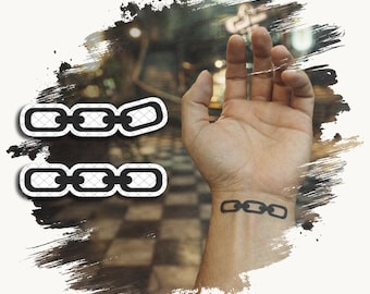 May include: Two black chain link stickers with a white border and a cross-hatched pattern inside the links. A matching black chain link design is applied as a temporary tattoo on the inner wrist, featuring three connected oval links.