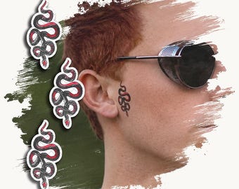 May include: Three individual temporary tattoos featuring a coiled black snake with a red underbelly, displayed alongside a profile view of a person wearing dark round sunglasses with a small matching snake tattoo applied to their cheek.