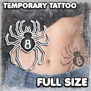 May include: Temporary tattoo featuring a black and white spider design with the number 8. The words "TEMPORARY TATTOO" and "FULL SIZE" are displayed in white text. The image shows the tattoo on a person's abdomen.