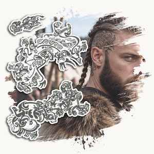 May include: A set of three temporary tattoos featuring intricate black and white Norse-inspired knotwork and animal motifs, displayed alongside a portrait of a person with a shaved head, braided hair, and a matching tattoo on their temple.