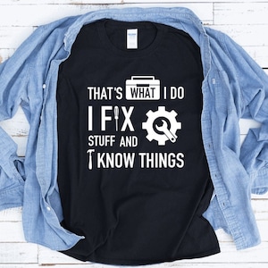 May include: Black t-shirt with white text that reads "That's what I do I fix stuff and I know things". The text is accompanied by a graphic of a toolbox, a screwdriver, and a wrench.