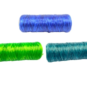 May include: Three spools of colorful twine in shades of blue, green, and teal. The twine is tightly wound, and the colors are vibrant against the white background. Ideal for crafting and DIY projects.