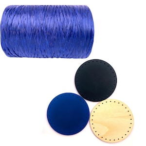 May include: A roll of vibrant blue raffia ribbon sits above three round craft bases. The bases are in navy blue, a lighter blue, and natural wood. Each base has evenly spaced holes around the edge for stitching or weaving.