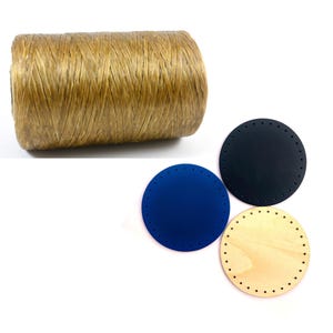 May include: A spool of natural-colored twine sits above three round craft bases. The bases are in navy blue, black, and light wood. Each base has evenly spaced holes around the perimeter, designed for stitching or weaving.