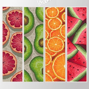 May include: Four different fruit patterns in a pixelated style. The patterns are of grapefruit, avocado, orange, and watermelon.