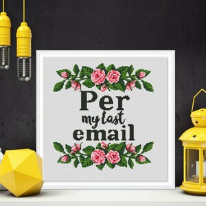 May include: White framed cross-stitch embroidery with pink roses and green leaves. The text reads "Per my last email".