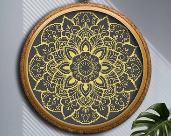 May include: A gold mandala design embroidered on black fabric, framed in a wooden hoop.