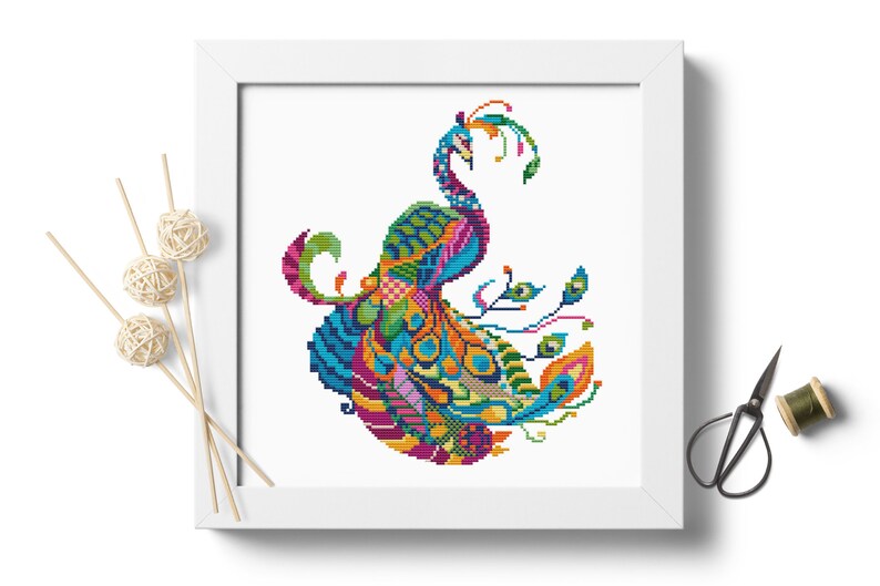 May include: A colourful cross-stitch pattern of a peacock with its tail feathers spread out. The peacock is made up of a variety of colours, including blue, green, yellow, orange, and pink.