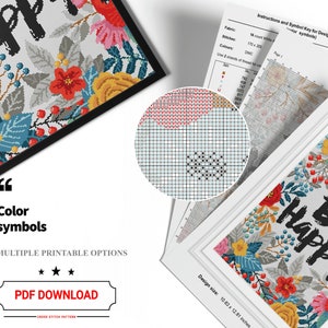 May include: Cross stitch pattern featuring a floral wreath with the text "Be Happy" in black. The pattern is in color and includes a symbol key for the different colors.