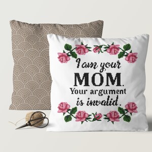 May include: White throw pillow with a pink rose border and the text "I am your MOM. Your argument is invalid."