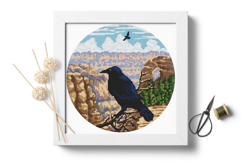 May include: A black raven perched on a branch overlooking a scenic canyon landscape with a natural arch in the distance. The sky is blue with white clouds and a smaller bird flies overhead.