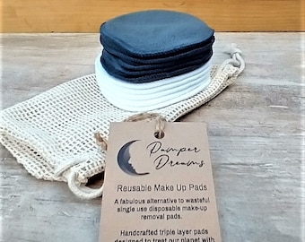 May include: A set of reusable black and white makeup remover pads in a white mesh bag with a brown tag that reads "Pamper Dreams" and "Reusable Make Up Pads". A fabulous alternative to wasteful single use disposable make-up removal pads. Handcrafted triple layer pads designed to treat our planet with kindness. www.pamperdreams.co.uk