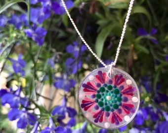 Hand made mandala pendant on silver tone chain.