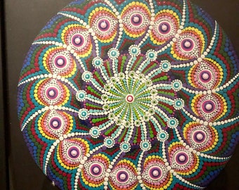 Mandala dot painted on canvas framed in glass for wall hanging or table top.