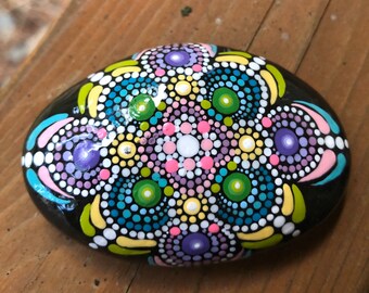 Oval shaped mandala dot painted rock handmade with acrylic paint.