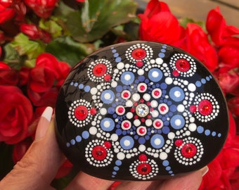 Hand dot painted mandala natural stone in red, white and blue gray with crystals and sealed with resin.