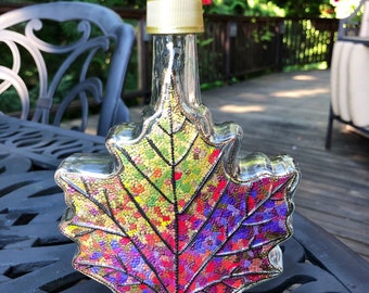 Glass Bottle Maple leaf hand painted in fall colors.