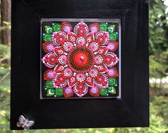 Framed dot painted mandala wall hanging art.