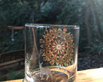 Mandala painted candle holder with deer etched in one side.