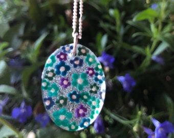 Handmade dot painted art necklace in blues and purple flower design.