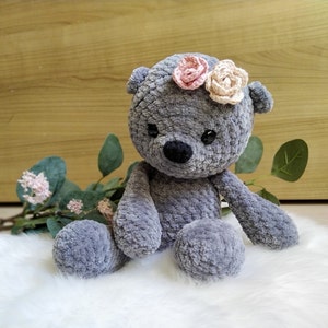 Crocheted bear with roses as a cuddly toy or music box