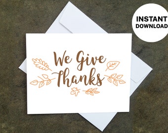 May include: A white card with the words "We Give Thanks" in brown script, surrounded by leaf and branch illustrations. The card is placed on a white envelope, with a circular "INSTANT DOWNLOAD" graphic in the upper right corner.