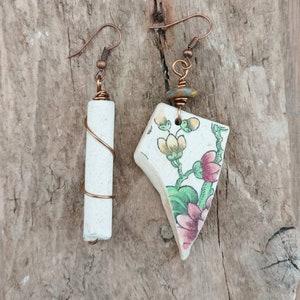 Handmade Mudlarks earrings featuring pink and yellow sea pottery and clay pipe stem combined with copper.