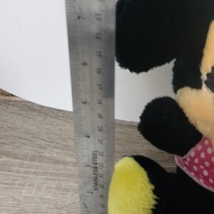 Minnie mouse plush from the 1960s cute. Clean . Rough around the edges , showing her age . See pics.in need of cuddles image 5