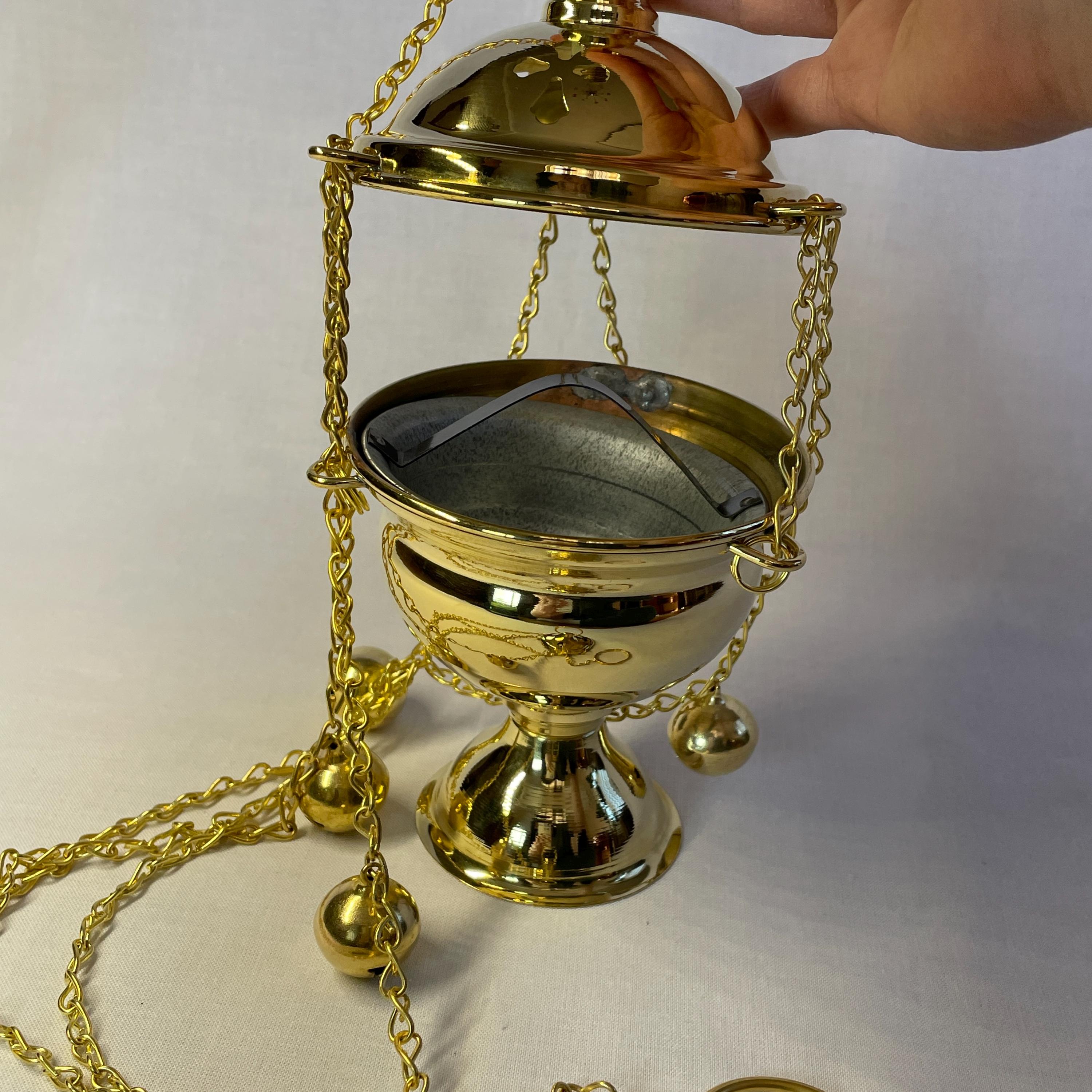 Tibetan Monk Holds A Censer, A Metal Vessel For Smoking Incense, During