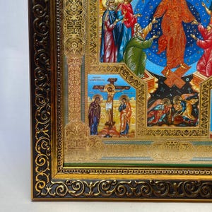 May include: Ornate religious icon featuring detailed artwork within a gold and black decorative frame. The icon depicts biblical scenes with figures in vibrant colors, including red, blue, and gold. The frame has intricate scrollwork and a green border.