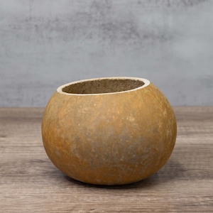An example of a dried gourd bowl that is 6-inches in diameter with a straight-cut top.
