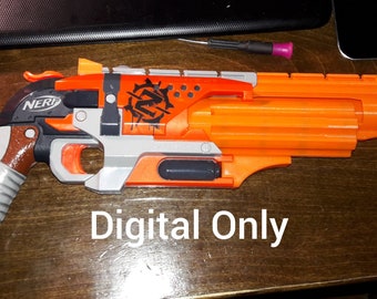 May include: Orange and gray Nerf gun with a brown and gray grip. The gun has a black and white sticker with a skull and crossbones on it. The text "Digital Only" is printed on the wooden surface below the gun.