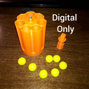 May include: Orange 3D printed cylinder with eight holes, a small orange plastic piece, and seven yellow balls on a wooden surface. The text "Digital Only" is written in black on a white background.