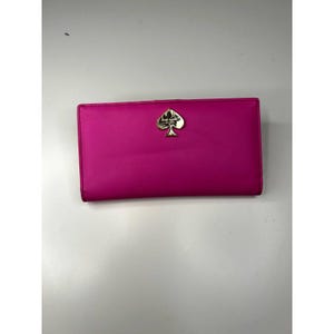 Cartera plegable delgada rosa de Kate Spade
