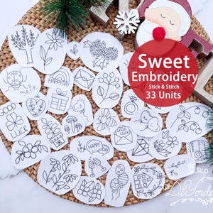 May include: A collection of 33 stick and stitch embroidery units with various black line art designs, including flowers, a ladybug, and a gift. The text "Sweet Embroidery" is displayed on a red circle.