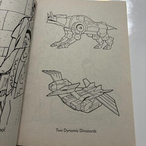 May include: Black and white line art illustration of two robot dinosaurs. The first robot dinosaur is a quadruped with a long tail and a horn on its head. The second robot dinosaur is a flying robot with two sets of wings. The text "Two Dynamic Dinozords" is printed below the illustrations.