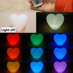 May include: A set of heart-shaped LED lights with a remote control. The lights can be set to different colors, including red, orange, yellow, green, blue, purple, and white. The lights are off in the first image, and then show different colors in the following images.  "Light off" and "Light Colors" are written on the image.