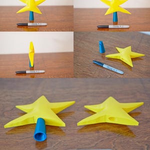 May include: A yellow star-shaped Christmas tree topper with a blue plastic base. The topper is shown from different angles, including a close-up of the base.