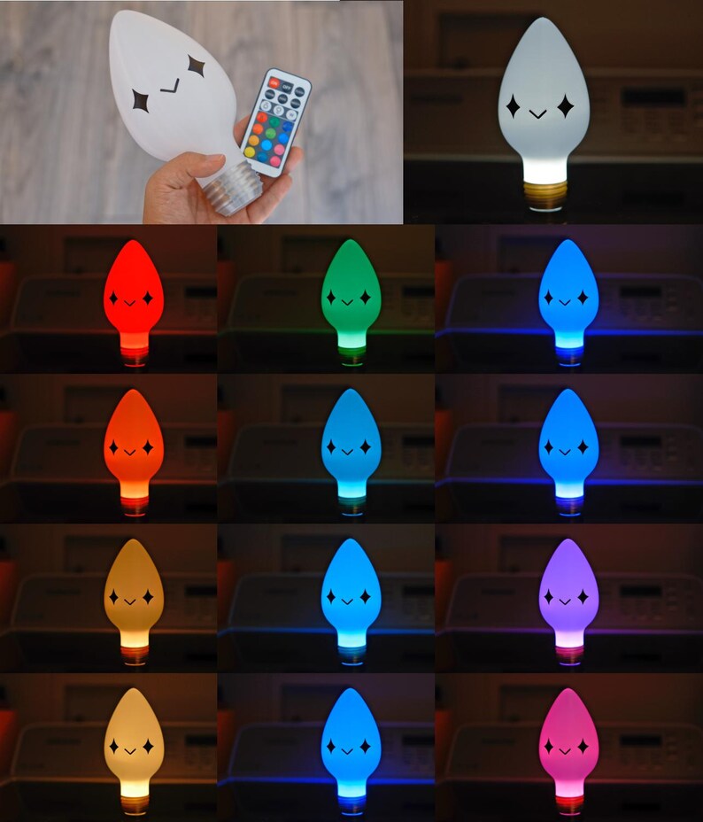 May include: A white, light-up bulb with a cartoon face and a remote control. The bulb's colour changes to red, green, blue, orange, yellow, and purple. The bulb has a standard base and a smiling face with diamond-shaped eyes.