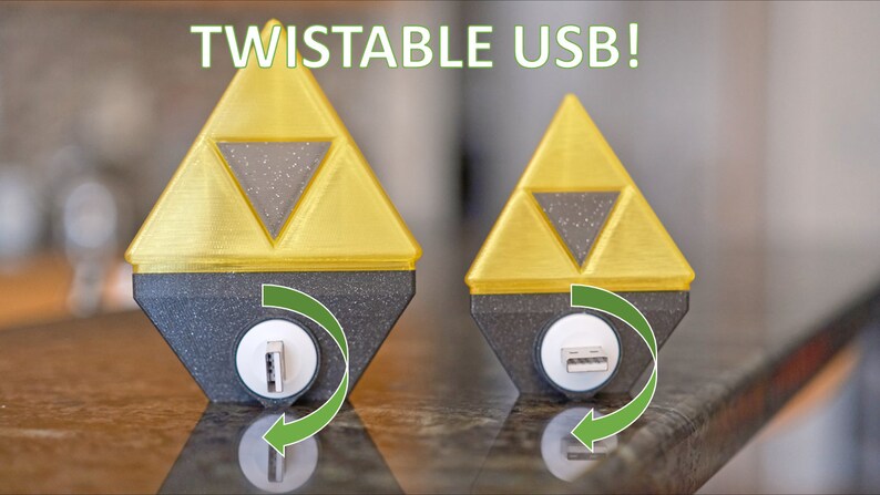 May include: Two gold-colored, 3D printed, triangular USB drives with a black base. The USB port is on the bottom of the base and can be rotated. The text "TWISTABLE USB!" is at the top of the image.