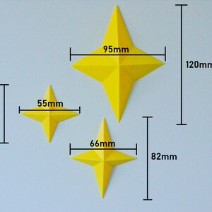 May include: Three yellow paper stars of different sizes. The largest star measures 95 mm wide and 120 mm tall. The middle star measures 66 mm wide and 82 mm tall. The smallest star measures 55 mm wide and 55 mm tall.